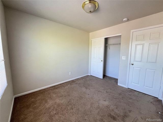 20558 E Grand Ln, Aurora, CO 80015 - unfurnished bedroom featuring carpet, a closet, and baseboards