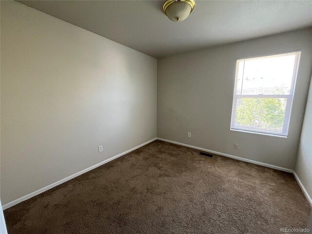 20558 E Grand Ln, Aurora, CO 80015 - carpeted spare room with baseboards