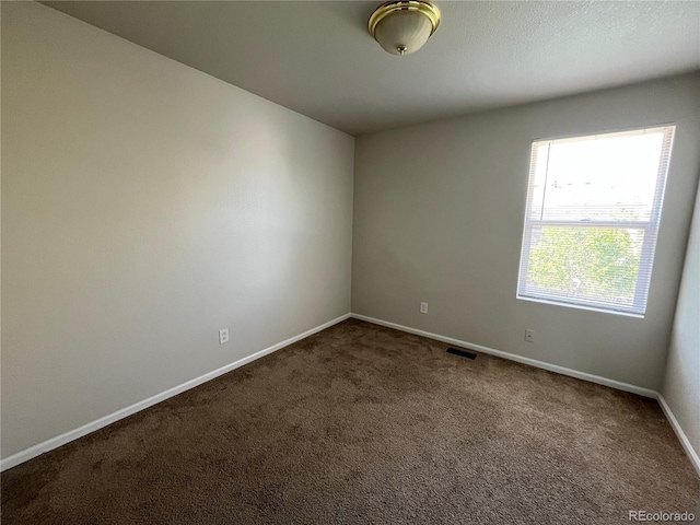 20558 E Grand Ln, Aurora, CO 80015 - carpeted empty room featuring baseboards