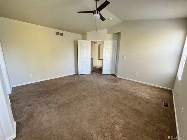 20558 E Grand Ln, Aurora, CO 80015 - unfurnished bedroom with vaulted ceiling, dark colored carpet, baseboards, and a ceiling fan