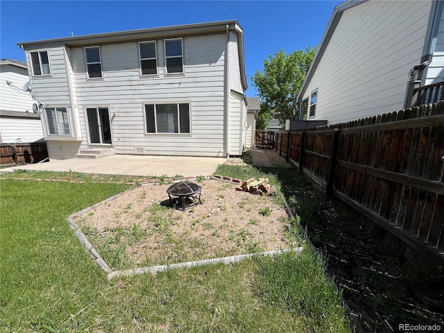 20558 E Grand Ln, Aurora, CO 80015 - back of property featuring an outdoor fire pit, entry steps, and a patio area