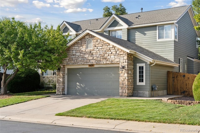 view of front facade with a front yard and a garage