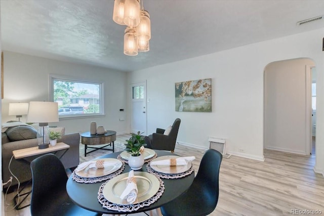 2684 S Logan St, Denver, CO 80210 - dining room with light wood-style flooring and baseboards