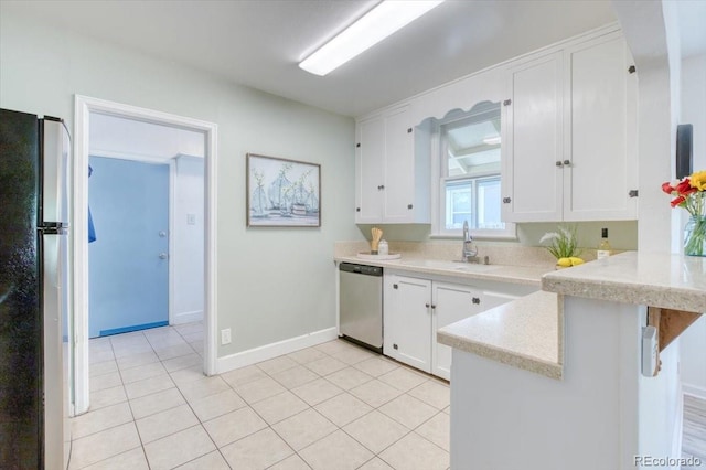 2684 S Logan St, Denver, CO 80210 - kitchen with appliances with stainless steel finishes, a peninsula, white cabinets, and a breakfast bar area