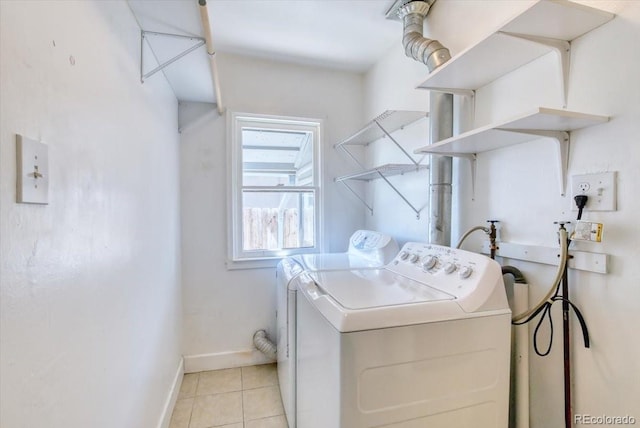 2684 S Logan St, Denver, CO 80210 - laundry area featuring separate washer and dryer, baseboards, and light tile patterned floors