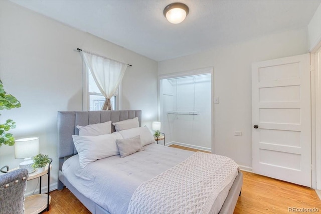 2684 S Logan St, Denver, CO 80210 - bedroom with light wood-style flooring and baseboards