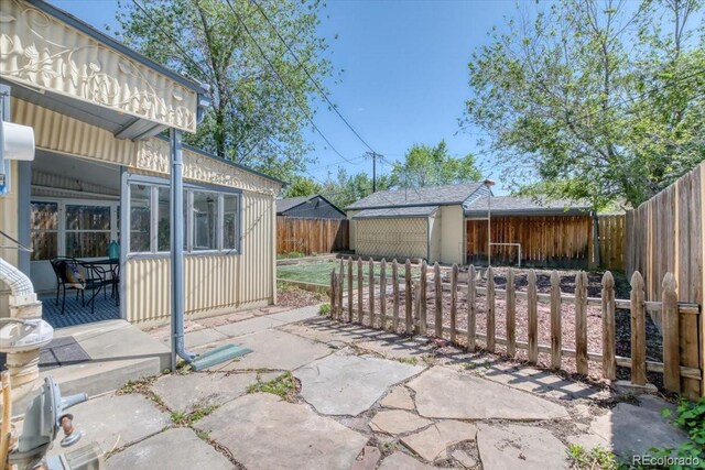 2684 S Logan St, Denver, CO 80210 - fenced backyard featuring a patio area