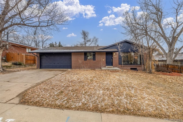 ranch-style home featuring a garage