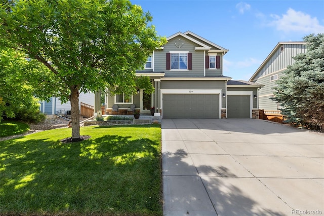139 N Prairie Falcon Pkwy, Brighton, CO 80601 - view of front facade with driveway, a front lawn, an attached garage, and stone siding