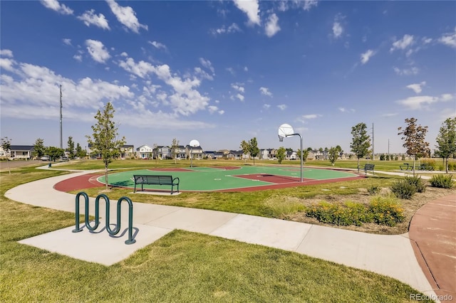 139 N Prairie Falcon Pkwy, Brighton, CO 80601 - surrounding community with a lawn and community basketball court