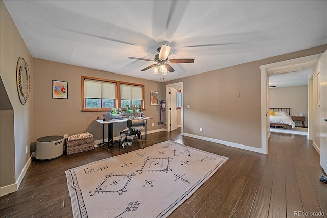 office space with baseboards, dark wood finished floors, and ceiling fan