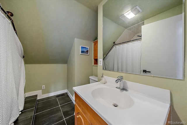 bathroom with vanity, tile patterned flooring, curtained shower, baseboards, and vaulted ceiling