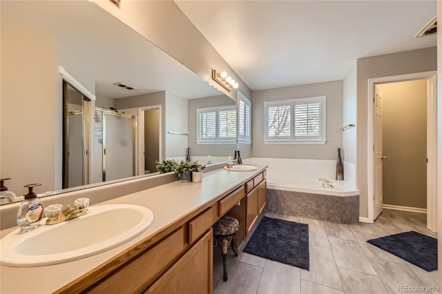 bathroom with double vanity, visible vents, a shower stall, and a sink