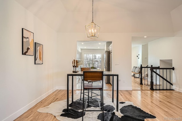 dining room featuring an inviting chandelier and light hardwood / wood-style flooring