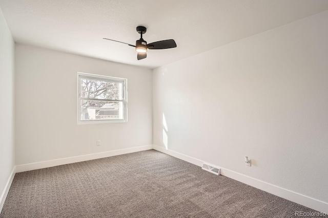 empty room with ceiling fan and carpet flooring