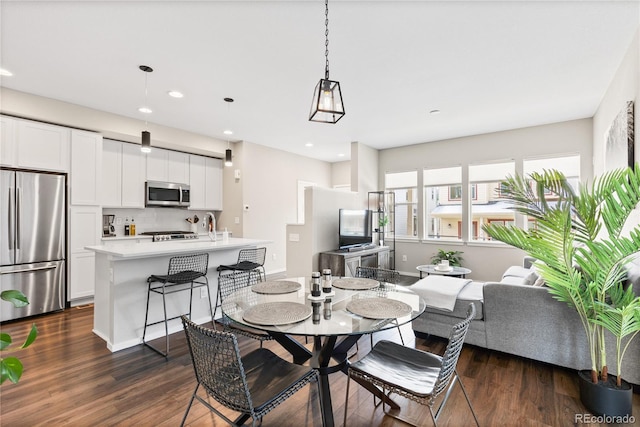 dining room featuring recessed lighting and dark wood finished floors
