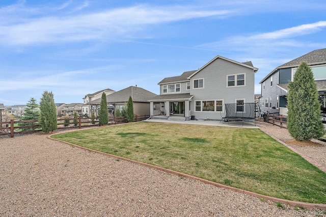 14589 Hagus Pl, Parker, CO 80134 - back of house featuring a patio area and a trampoline