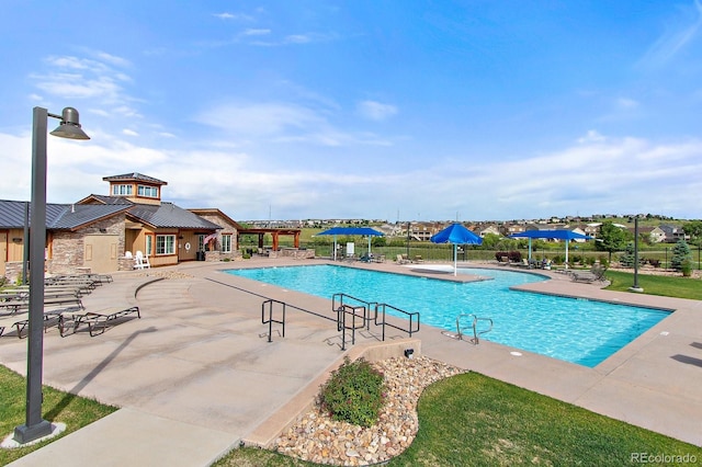 14589 Hagus Pl, Parker, CO 80134 - community pool featuring a patio area