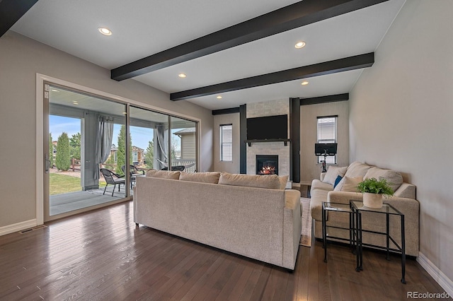 14589 Hagus Pl, Parker, CO 80134 - living area with baseboards, a large fireplace, dark wood-style flooring, beamed ceiling, and recessed lighting