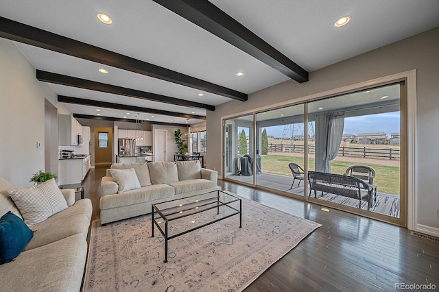 14589 Hagus Pl, Parker, CO 80134 - living room featuring beamed ceiling, recessed lighting, baseboards, and dark wood finished floors