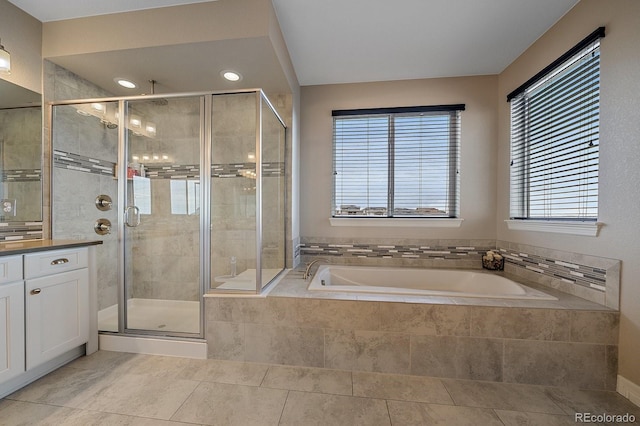 14589 Hagus Pl, Parker, CO 80134 - bathroom with plenty of natural light, a garden tub, a stall shower, vanity, and recessed lighting