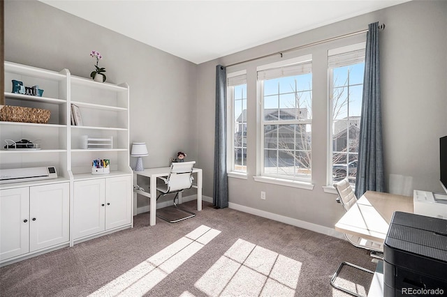 carpeted office featuring baseboards