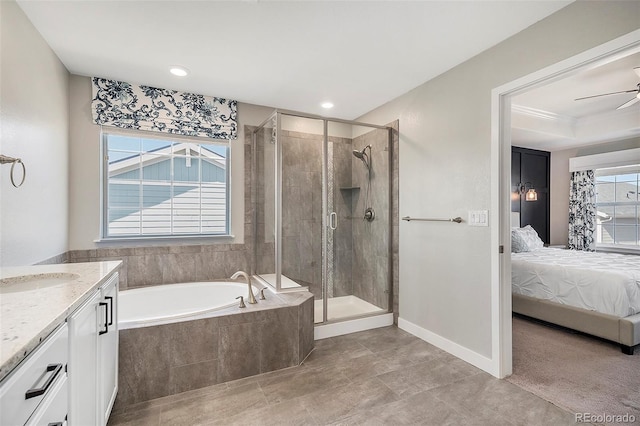 bathroom with a garden tub, a stall shower, ensuite bath, ceiling fan, and vanity