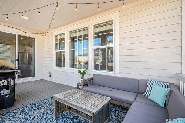 wooden terrace featuring outdoor lounge area