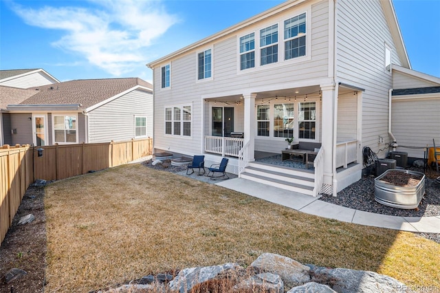 back of house with a yard, a patio area, and fence