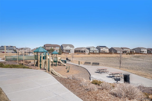 community jungle gym with a residential view