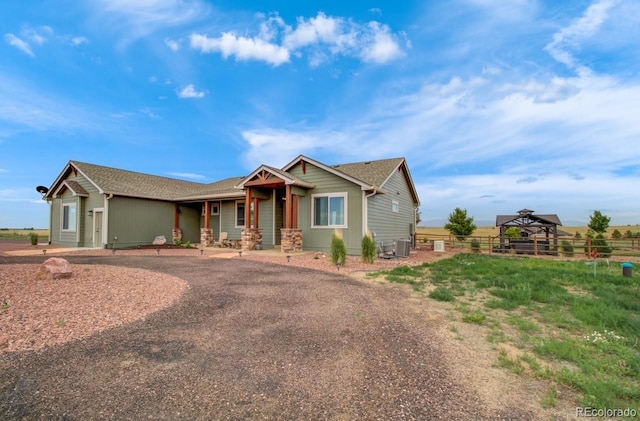 craftsman-style home featuring cooling unit