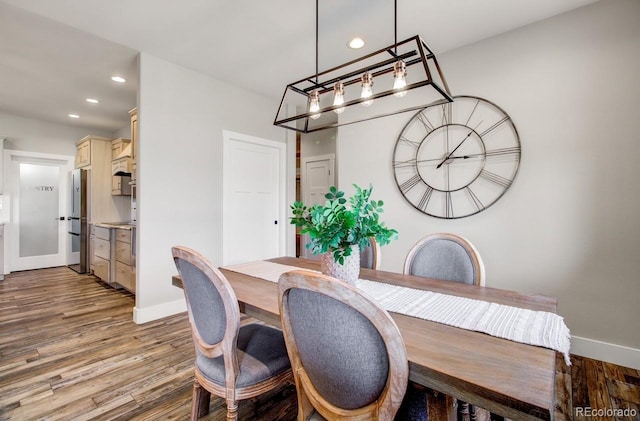 dining room with wood-type flooring