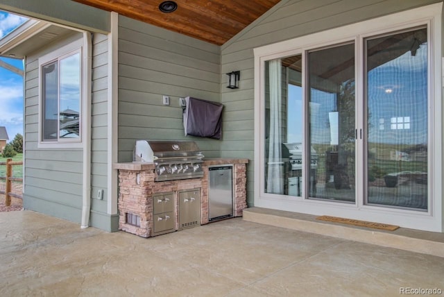 view of patio with area for grilling and grilling area