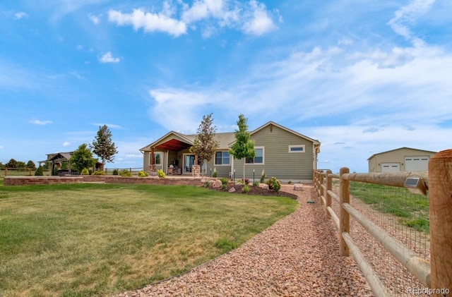 view of front of property with a garage and a front yard