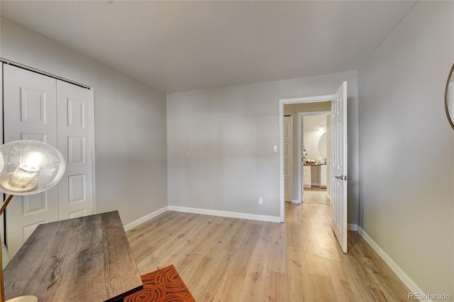 entryway with light wood-style floors and baseboards