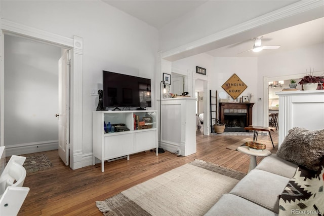 1776 S Logan St, Denver, CO 80210 - living area with hardwood / wood-style floors, ceiling fan, baseboards, and a fireplace with raised hearth