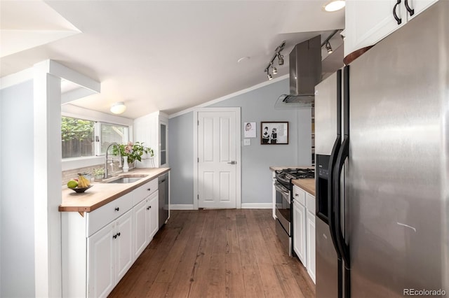 1776 S Logan St, Denver, CO 80210 - kitchen featuring stainless steel appliances, a sink, lofted ceiling, white cabinetry, and island exhaust hood