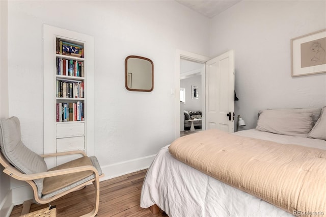 1776 S Logan St, Denver, CO 80210 - bedroom featuring wood finished floors and baseboards