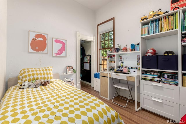 1776 S Logan St, Denver, CO 80210 - bedroom featuring wood finished floors and an office area