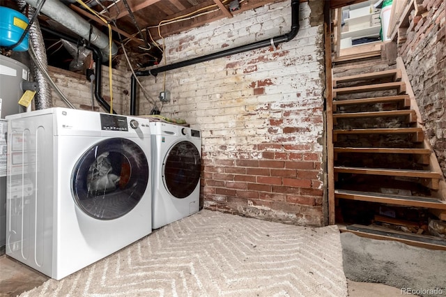 1776 S Logan St, Denver, CO 80210 - laundry room featuring washing machine and clothes dryer and brick wall