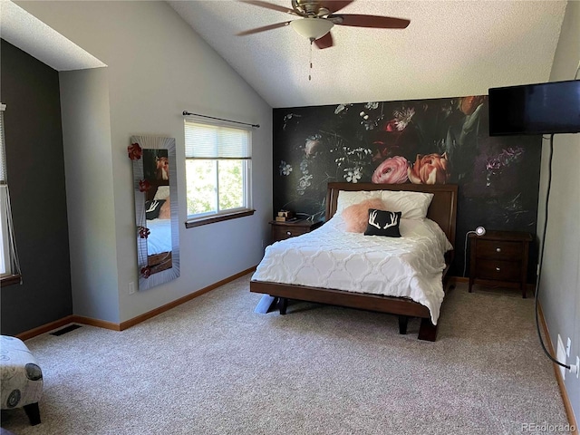carpeted bedroom featuring visible vents, baseboards, ceiling fan, a textured ceiling, and vaulted ceiling