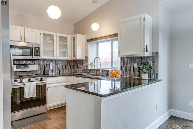 6365 Xavier Ct, Arvada, CO 80003 - kitchen featuring stainless steel appliances, a sink, white cabinets, and dark wood-style flooring