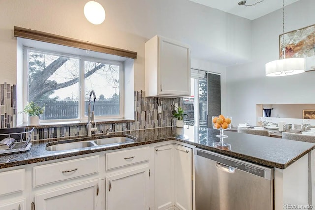 6365 Xavier Ct, Arvada, CO 80003 - kitchen with stainless steel dishwasher, a sink, white cabinets, and plenty of natural light