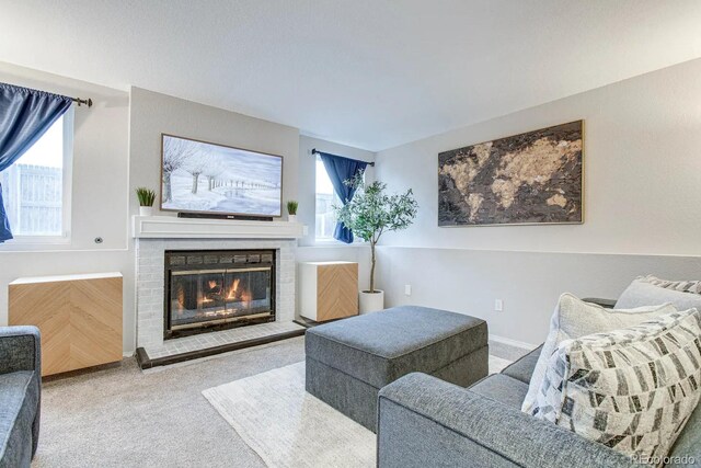 6365 Xavier Ct, Arvada, CO 80003 - carpeted living area featuring healthy amount of natural light and a glass covered fireplace