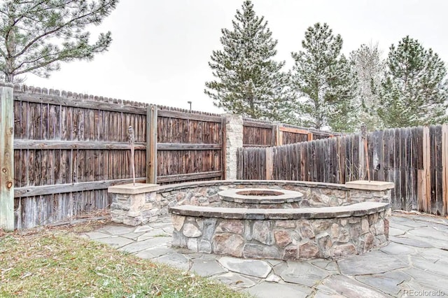 6365 Xavier Ct, Arvada, CO 80003 - fenced backyard with an outdoor fire pit and a patio