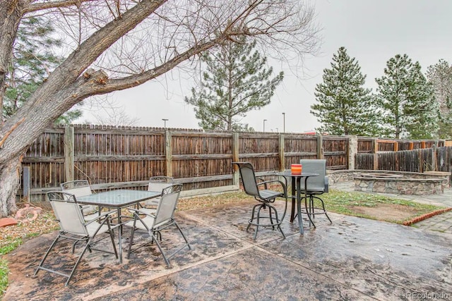 6365 Xavier Ct, Arvada, CO 80003 - fenced backyard with outdoor dining space and a patio area