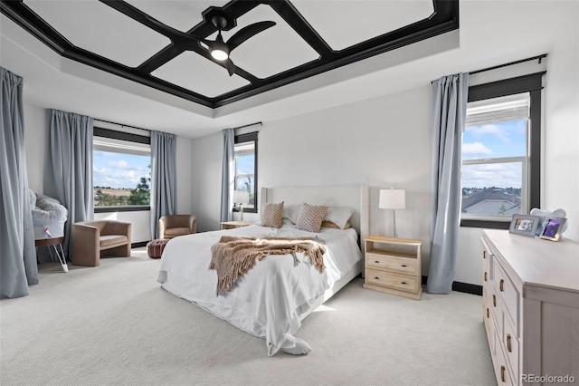 bedroom with light colored carpet and ceiling fan