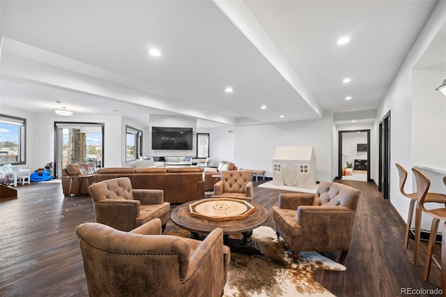 living area featuring dark wood-style flooring and recessed lighting