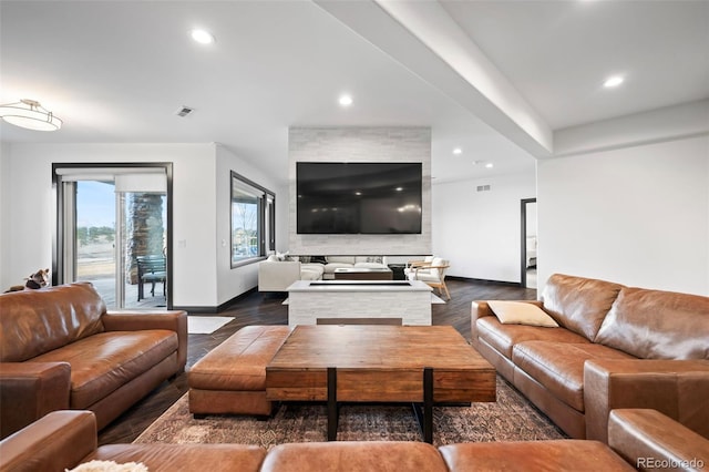 living area featuring recessed lighting, dark wood finished floors, and baseboards