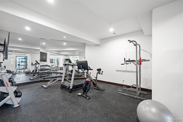 exercise room featuring recessed lighting and baseboards